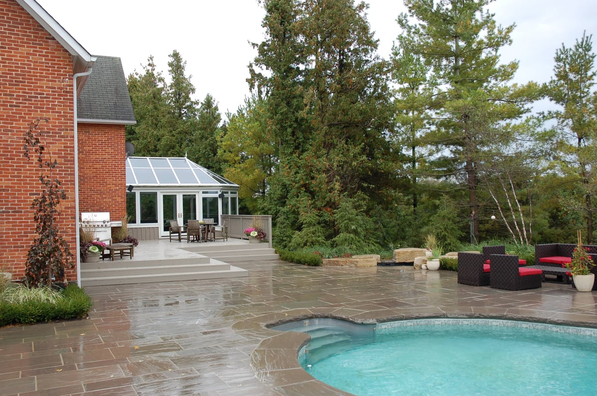 mass planting and stone patio